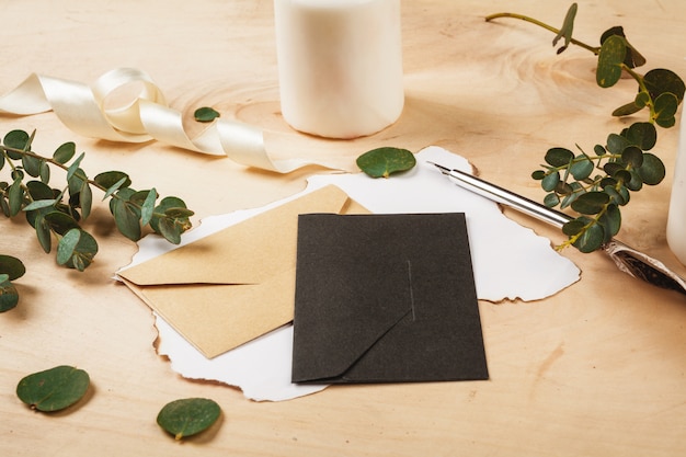 Seasonal letter with a vintage feather quill pen on wooden background 