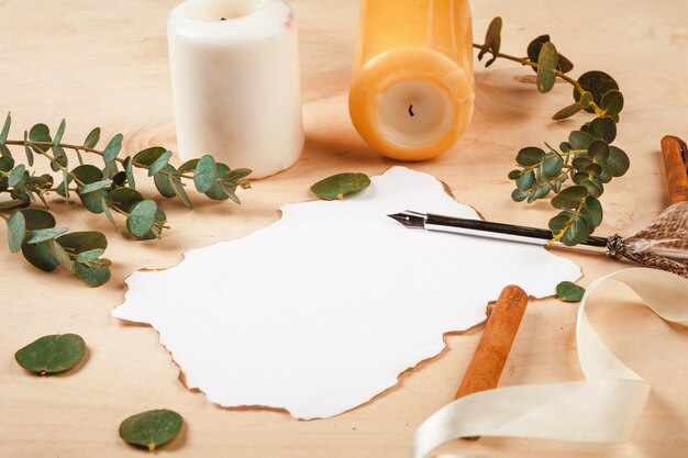 Seasonal letter with a vintage feather quill pen on wooden  