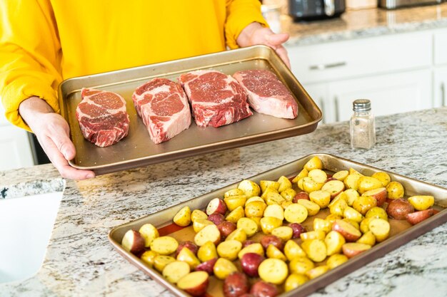 Seasoned rib eye steak ready for grilling