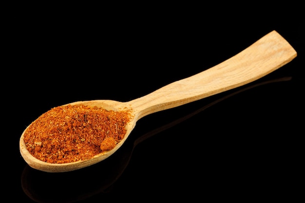 Seasoning for meat in a wooden spoon