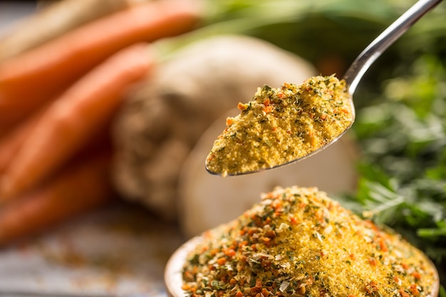 Seasoning spices condiment vegeta from dehydrated carrot parsley celery parsnips and salt with or without glutamate.