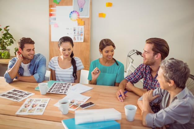 Seated creative business team working together