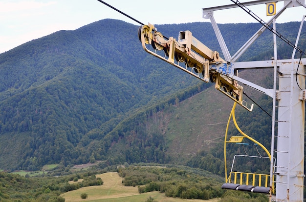 The seats of the cable car on the background of Mount Makovitsa