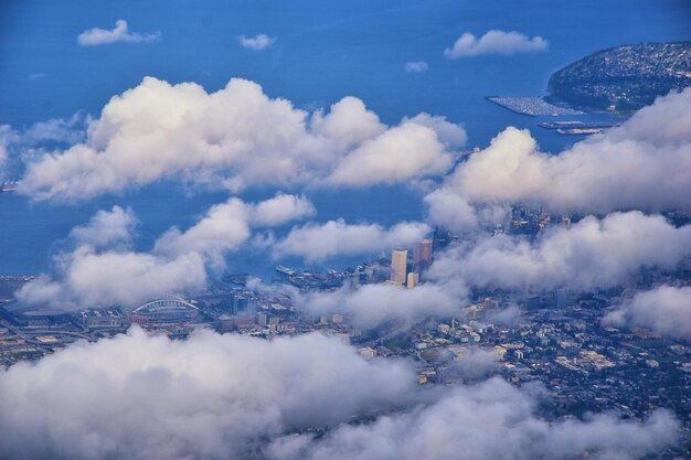 Seattle oregon aerial views from airplane cloud cover sea ocean and city views