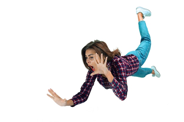 Photo a second before falling - young girl falling down with bright emotions and expression
