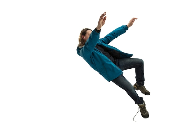 Photo a second before falling - young man falling down with bright emotions and expression