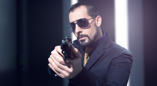 Photo secret agent holding a gun