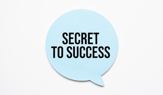 Secret to Success speech bubble and black magnifier isolated on the yellow background.