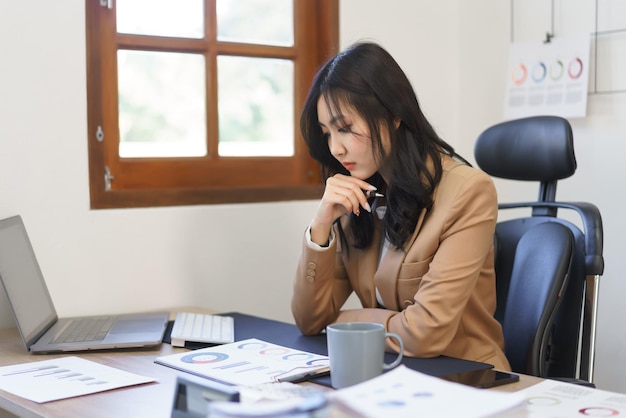 Secretary concept Female secretary reading business document and thinking about finance data