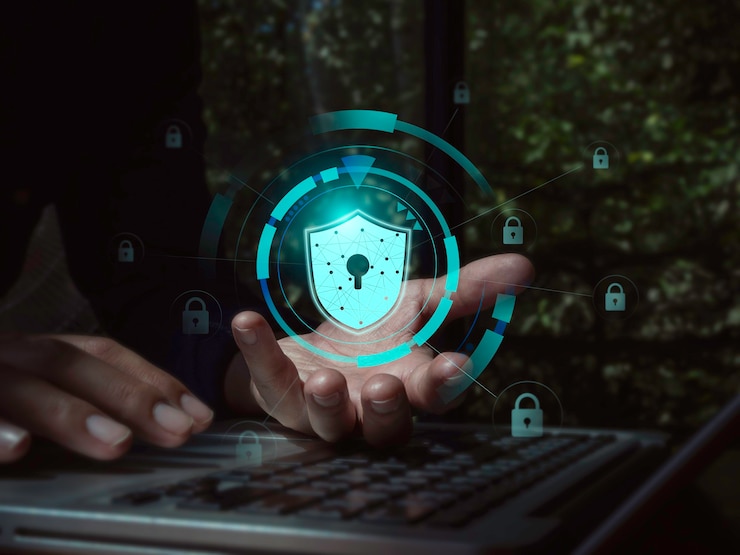 Secure data, Internet security data protection with business technology privacy concept. Safety virtual icon, shield, padlock on cyber network connection in businessman's hand while using laptop.