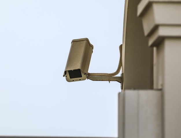 security camera on the yellow wall