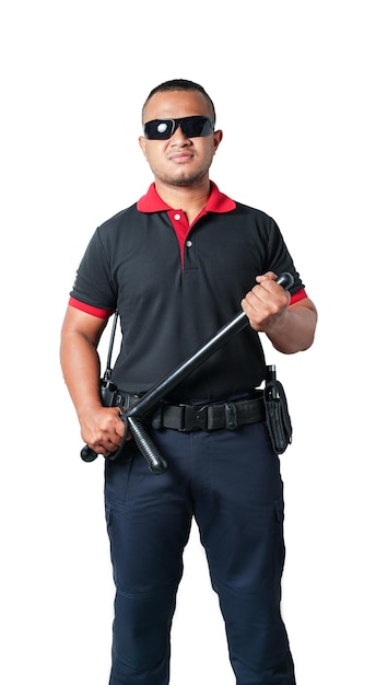 A security guard in a black uniform wearing dark glasses stood looking straight. With a strong stand and holding a rubber baton on a white background isolated, cut out. Security concept