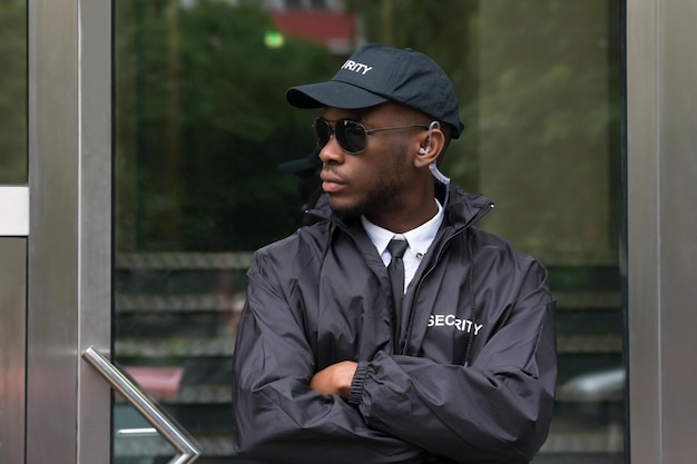 Photo security guard standing arms crossed