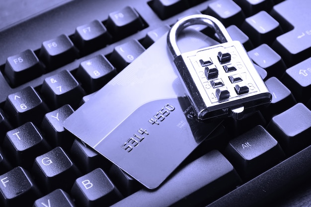 Security lock on credit cards with computer keyboard. Selective focus, soft focus and shallow depth of fields - DOF