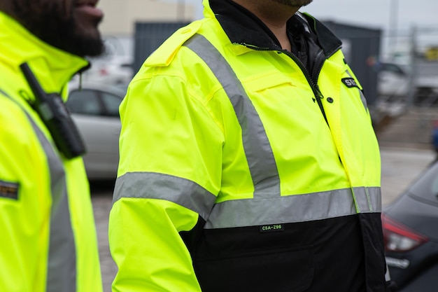 Photo security in uniforms watching over the parking area