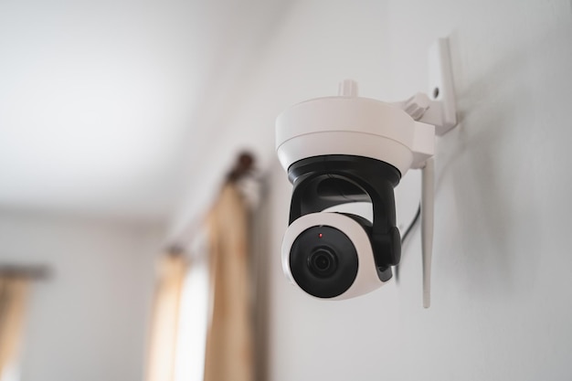 Security white CCTV Closedcircuit television camera in the house interior CCTV in home office in the house