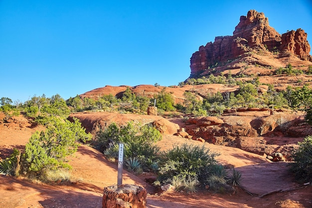 Sedona Red Sandstone Formations with Hiking Trail Sign