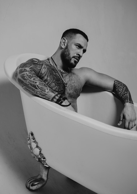 Seductive sexy man in bath Macho looking confident