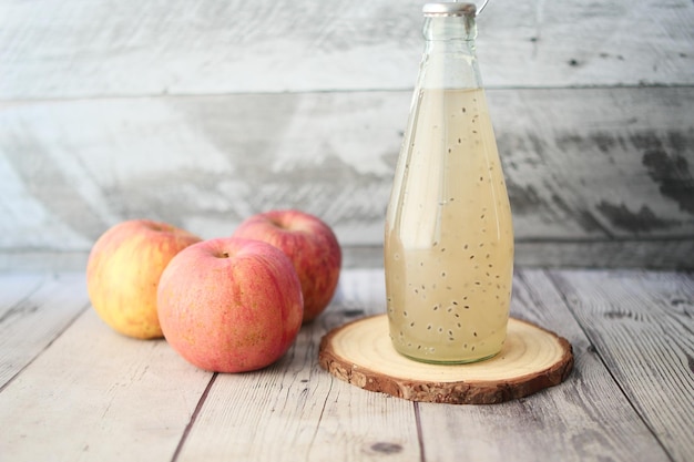 Seed apple juice in a bottle on table