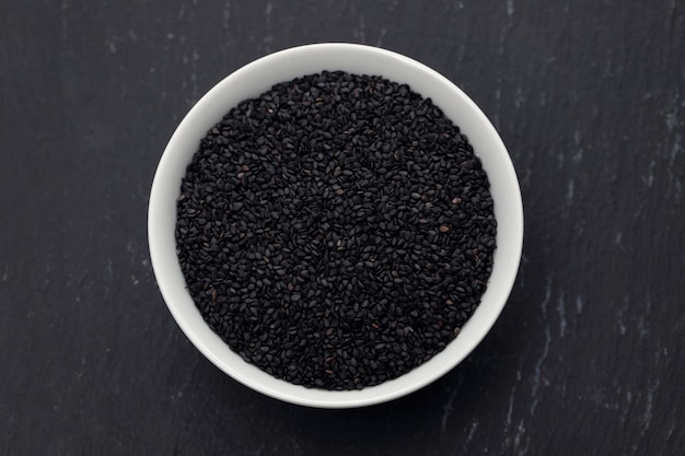 Seeds of black sesame in the white bowl