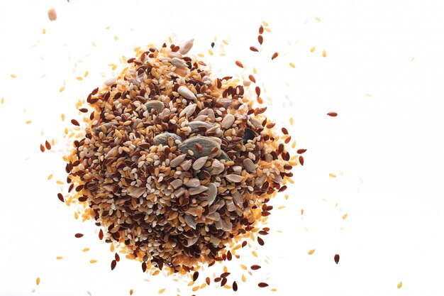 Seeds of different types: flax, sesame seeds, sunflower seeds and pumpkin seeds