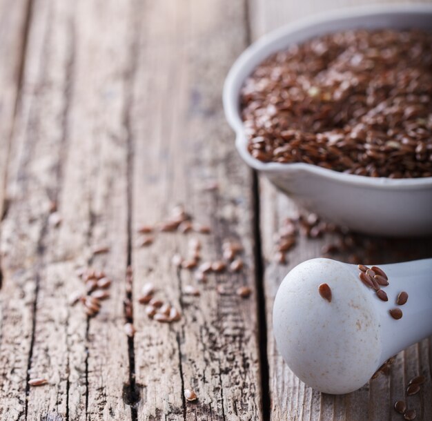 Seeds of the flax in a white porcelain bowl 