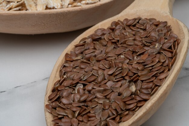 Seeds on a wooden spoon close up