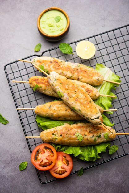 Seekh Kabab made with minced chicken or Mutton keema, served with green chutney and salad