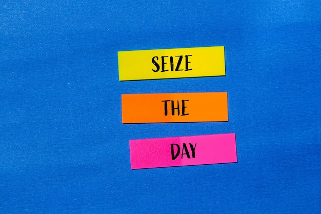 Photo seize the day words written colorful paper stickers with blue background