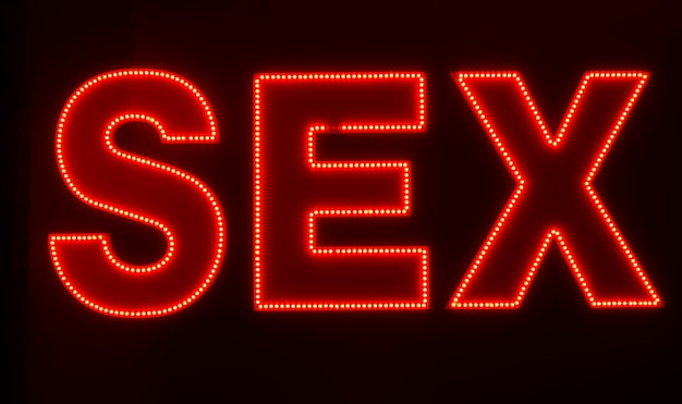 Foto sekswoord geschreven in lighttbox neonlichten