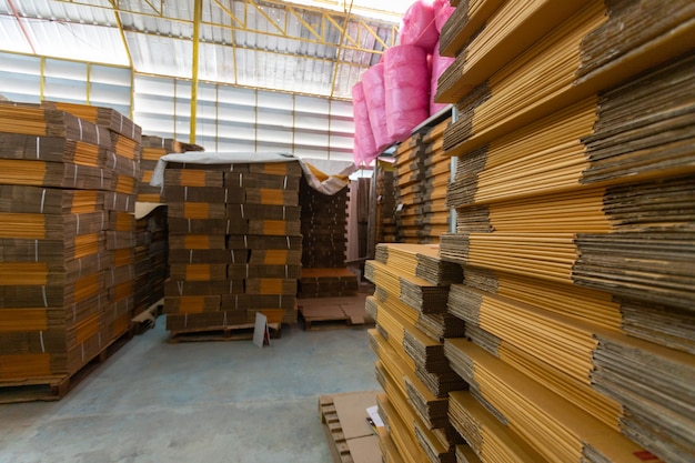 Select focus of Row of brown boxes, rack stack arrangement of cardboard boxes in a store warehouse.