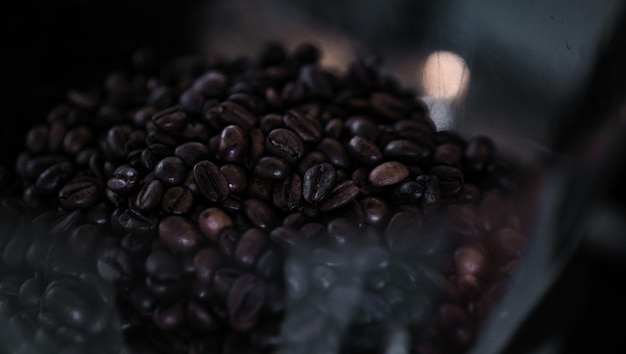 Photo selected coffee beans in a glass jar