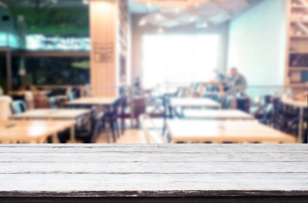 Selected focus empty brown wooden table and Coffee shop