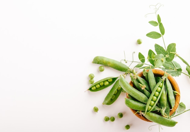 selected peas in a wooden bowl with space for text