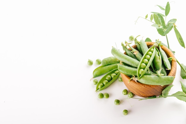 selected peas in a wooden bowl with space for text