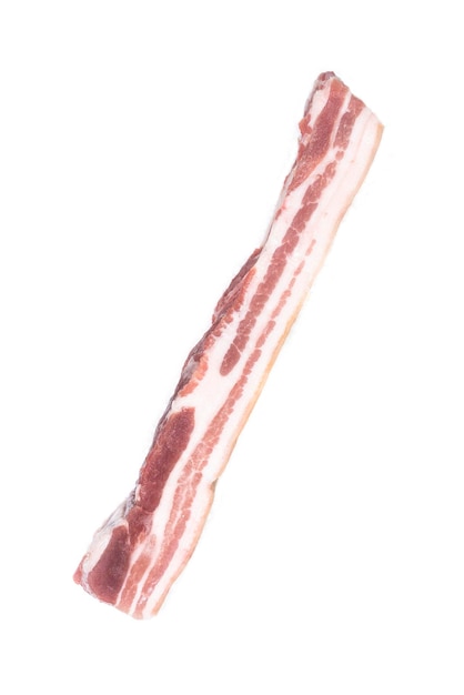 A selected piece of pork belly laid out on a white background