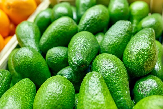 Selected ripe avocado boxes boxes of avocado Daylight View from above horizontal