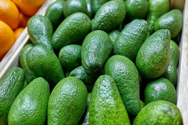 Selected ripe avocado boxes. boxes of avocado. Daylight. View from above. horizontal