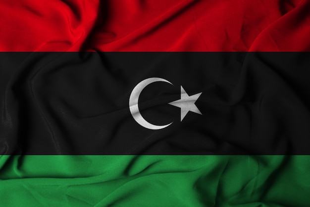 Selectieve focus van de vlag van Libië, met wuivende stoffentextuur. 3d illustratie