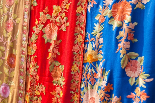 Selection of colorful women scarves at a market