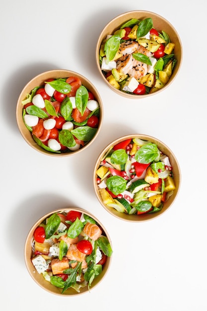 Selection of different salads in bowl at the table