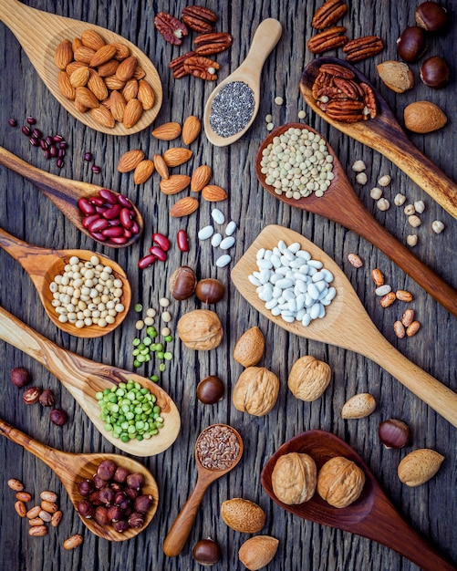 Selection food sources of omega 3 and unsaturated fats on wooden background.