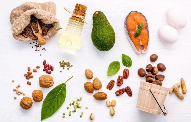 Selection food sources of omega 3 and unsaturated fats on wooden background.