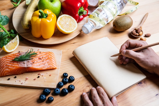 Selection of healthy food for heart on wooden background