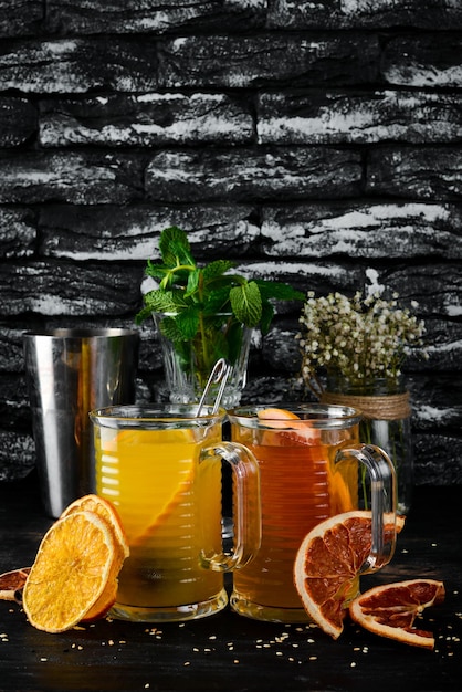 A selection of hot cocktails Winter drinks Hot wine On a black wooden background Top view Free copy space