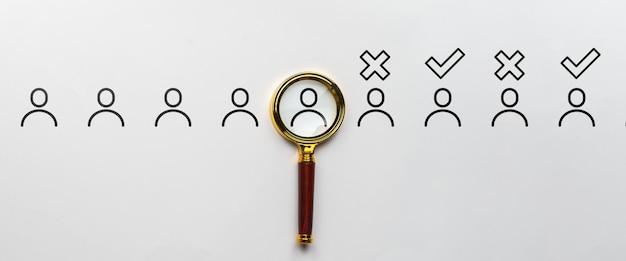 Selection of job candidates Magnifying glass with abstract personas Acceptance and rejection