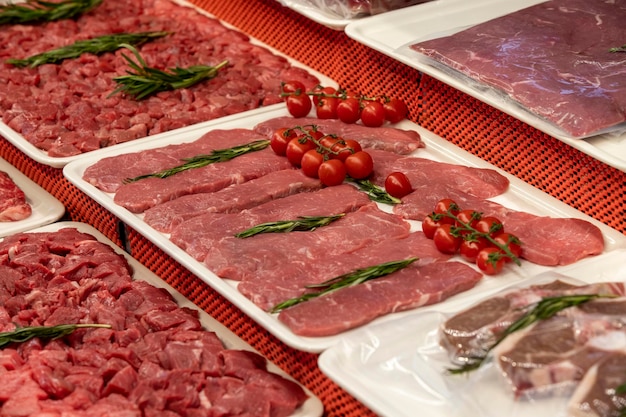 Selection of quality meat in a butcher shop Different types of fresh meat are on display Meat assortment