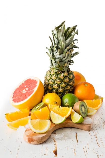 Selection of tropical fruits on white table