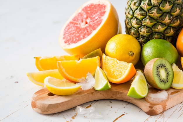 Photo selection of tropical fruits on white table