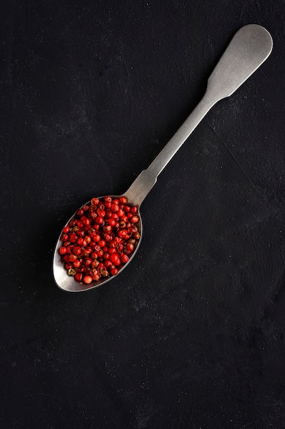 Selection of various species and herbs in bowl and spoons